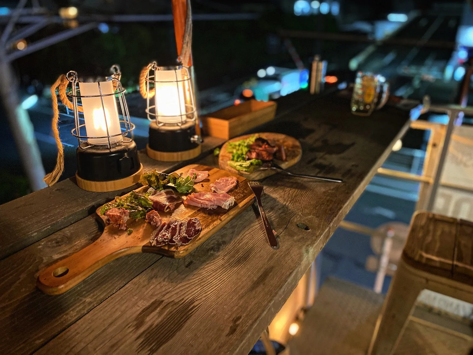 An outdoor dining board with lantern light, used as a general image for a Karuizawa fermentation and mountain-food service note.
